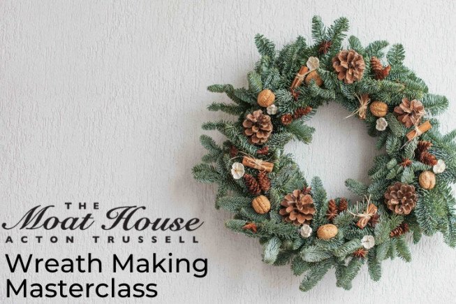 Decorative wreath with pinecones and nuts on a wall