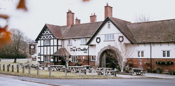 Exterior view of The Dog & Doublet Inn on a cloudy day
